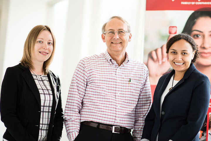 Center director George M. Telthorst stands with two students.